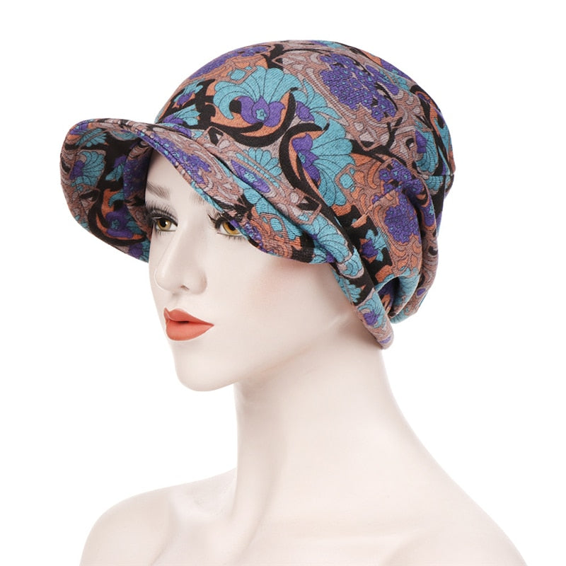 Le foulard casquette chimio OCEANE pour femme, couleur violet et turquoise à motifs dessins